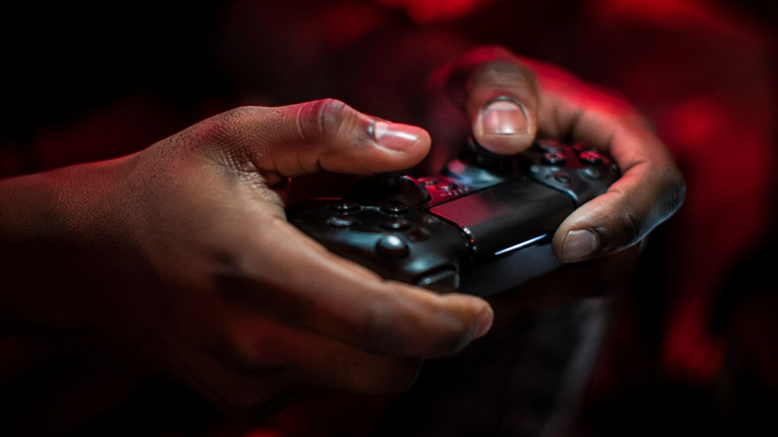 Hands gripping the controller